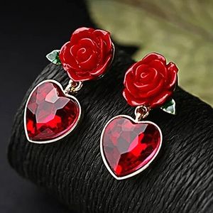 Fine jewelry red heart ❤️ crystal stud earrings with metal backs.